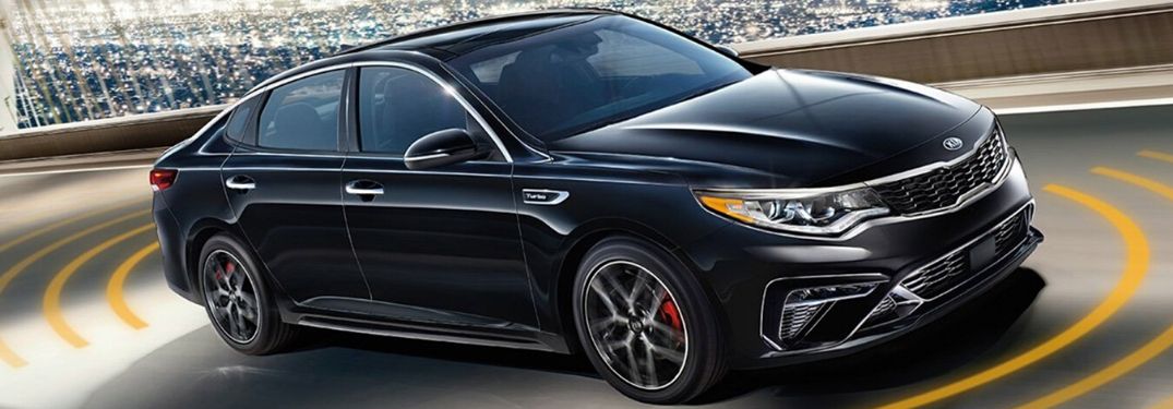 2020 Kia Optima driving on the road front side view