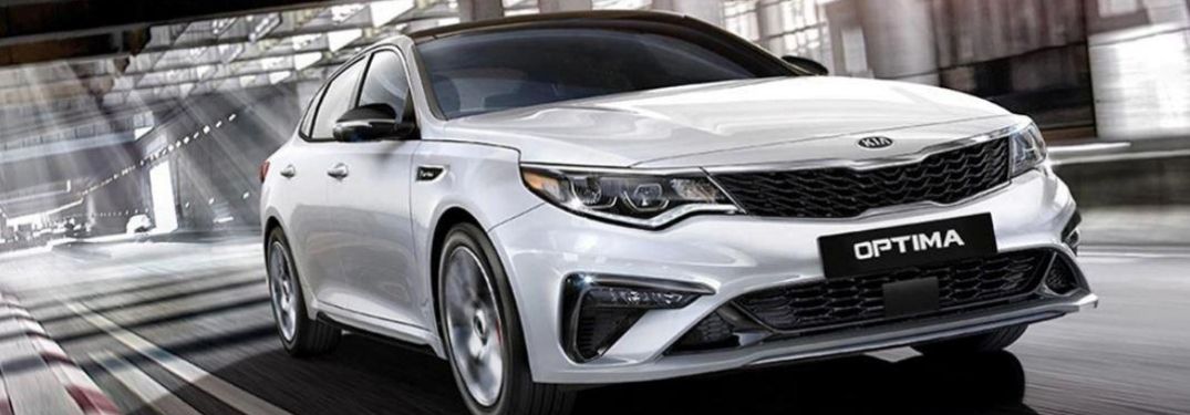 2020 Kia Optima front view while on the road
