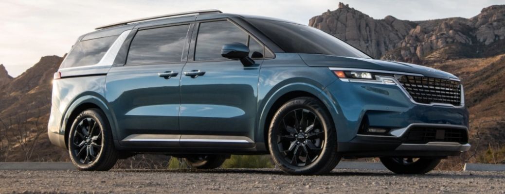 Blue 2022 Kia Carnival side view. What are the safety features?